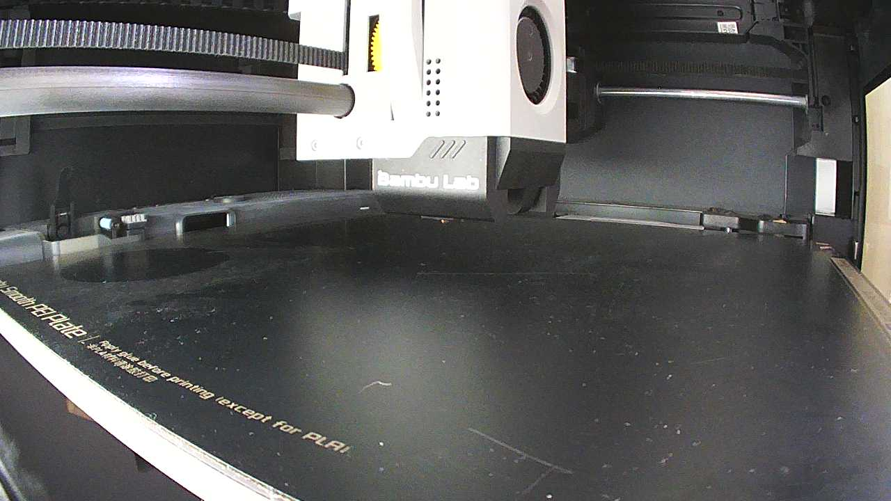 The camera inside the Bambu Lab P1S: the print head over an empty bed