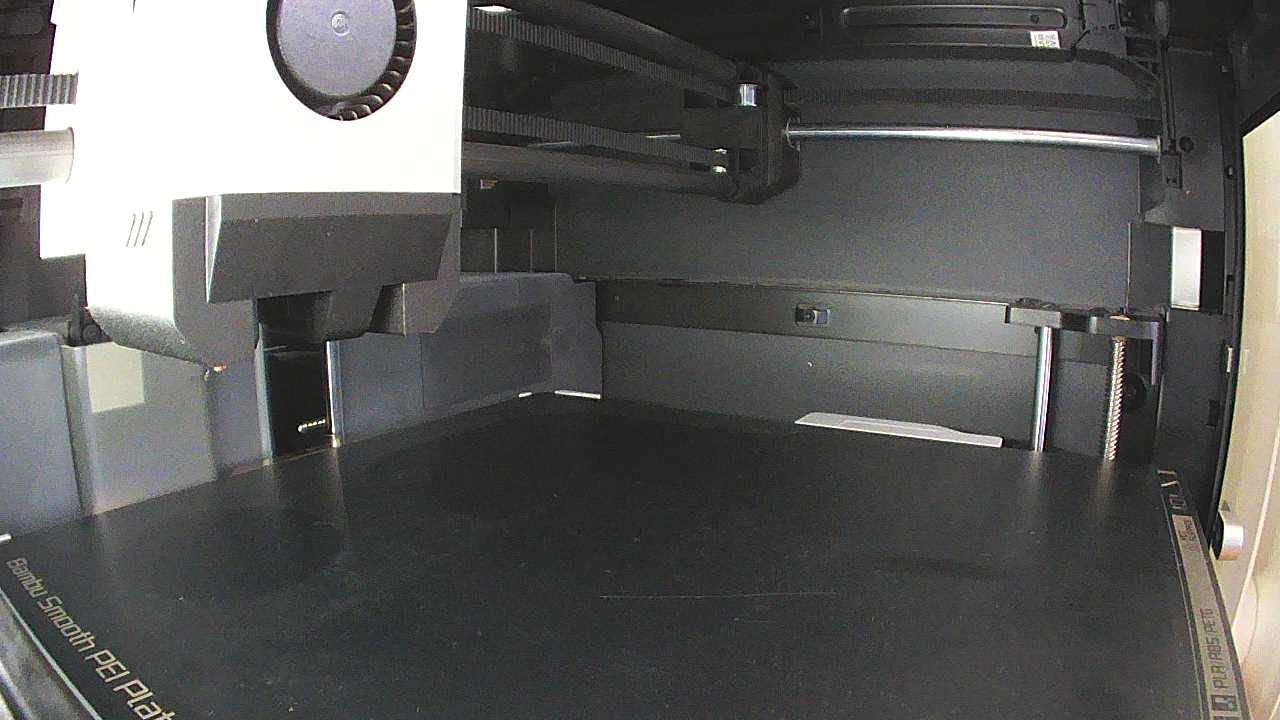 The camera inside the printer: a clean, empty bed ready to print